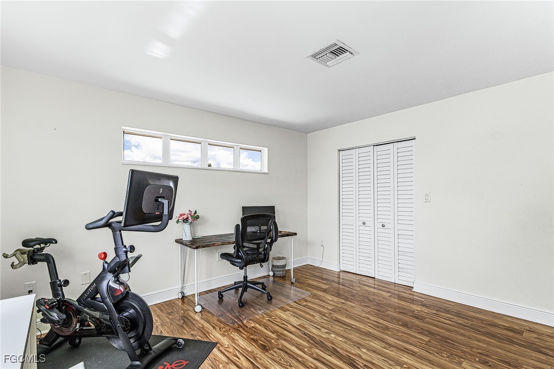 1060 Cooper Drive Naples, FL 34103 - Photo 20 of 33 a view of a workspace with furniture and a window