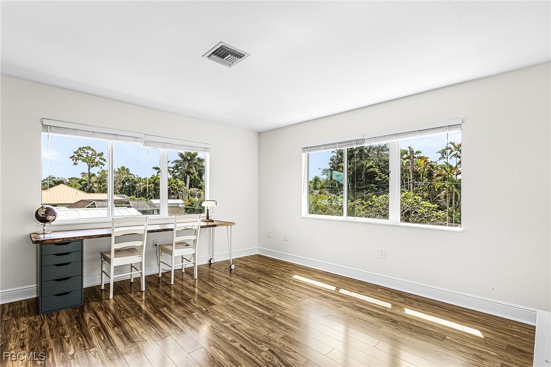 1060 Cooper Drive Naples, FL 34103 - Photo 21 of 33 a view of a workspace with furniture and a window