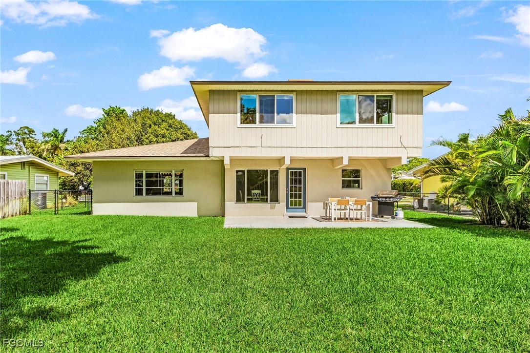 1060 Cooper Drive Naples, FL 34103 - Photo 27 of 33 a front view of house with yard and green space