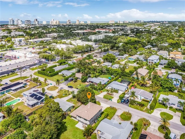 an aerial view of residential houses with outdoor space