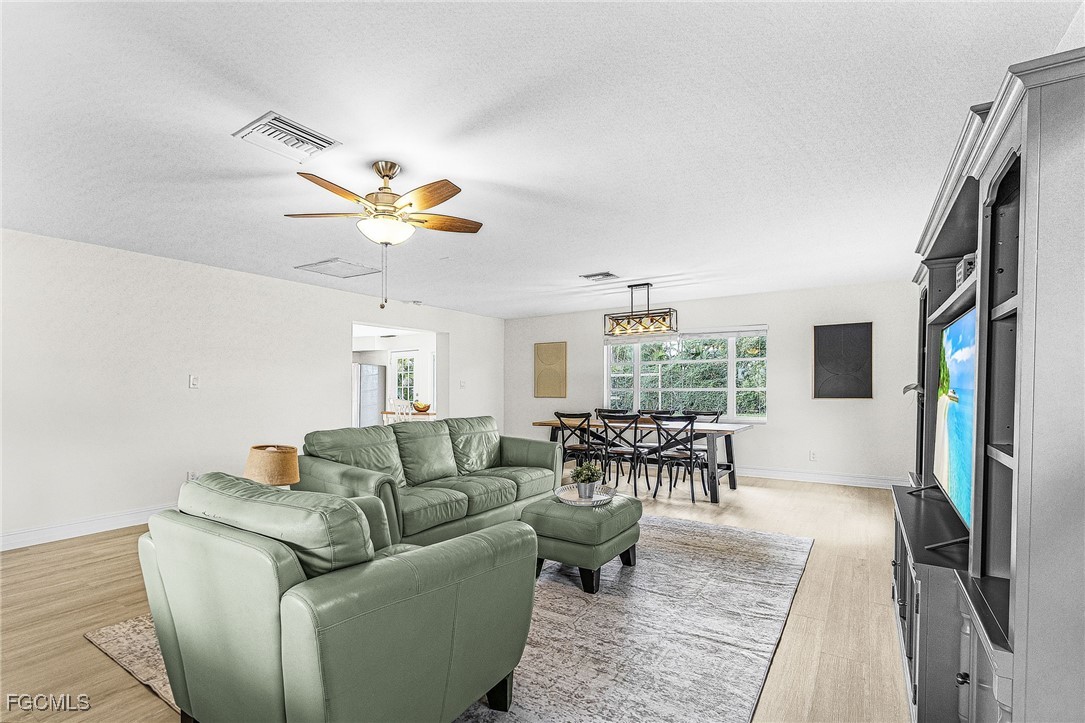 1060 Cooper Drive Naples, FL 34103 - Photo 6 of 33 a living room with furniture and a large window