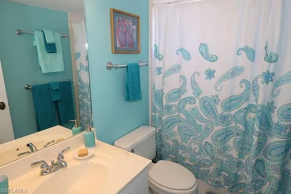 a bathroom with a sink and toilet