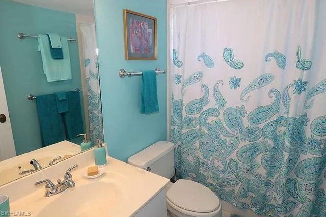 a bathroom with a sink and toilet