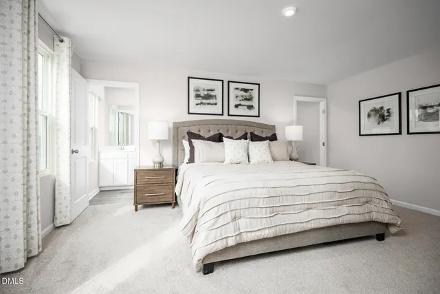 a spacious bedroom with a bed and a couch