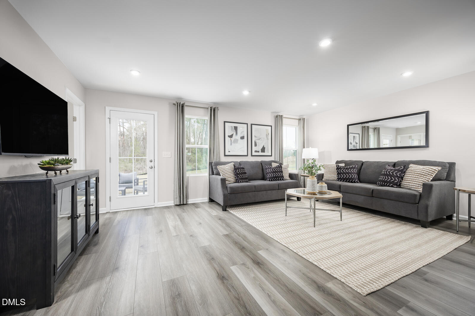 116 Cavalier Rider Run Wendell, NC 27591 - Photo 7 of 21 a living room with furniture and a flat screen tv