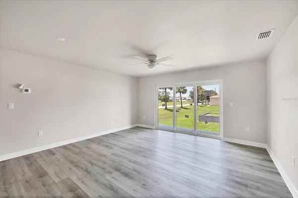 a kitchen with stainless steel appliances a refrigerator sink and microwave