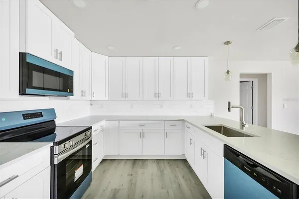 a bathroom with 2 sink and a mirror