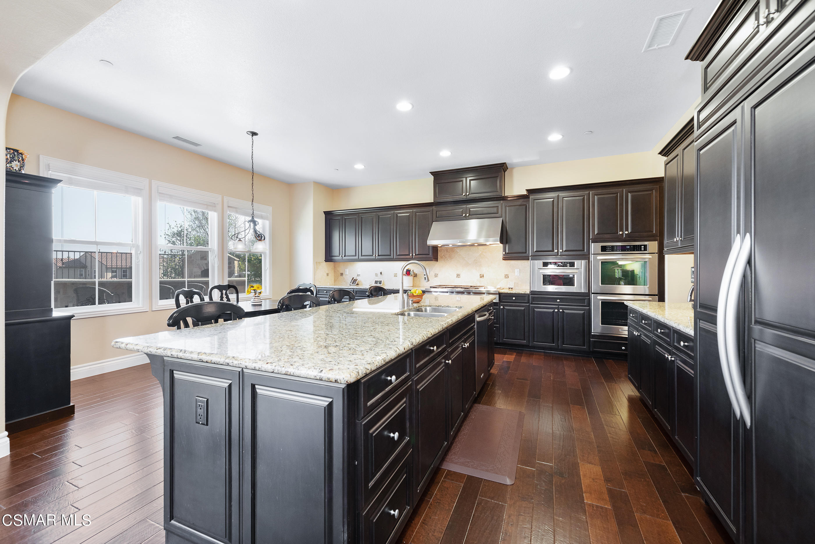 13740 Pinefield Court Moorpark, CA 93021 - Photo 15 of 62 a kitchen with stainless steel appliances granite countertop a sink a stove and a refrigerator