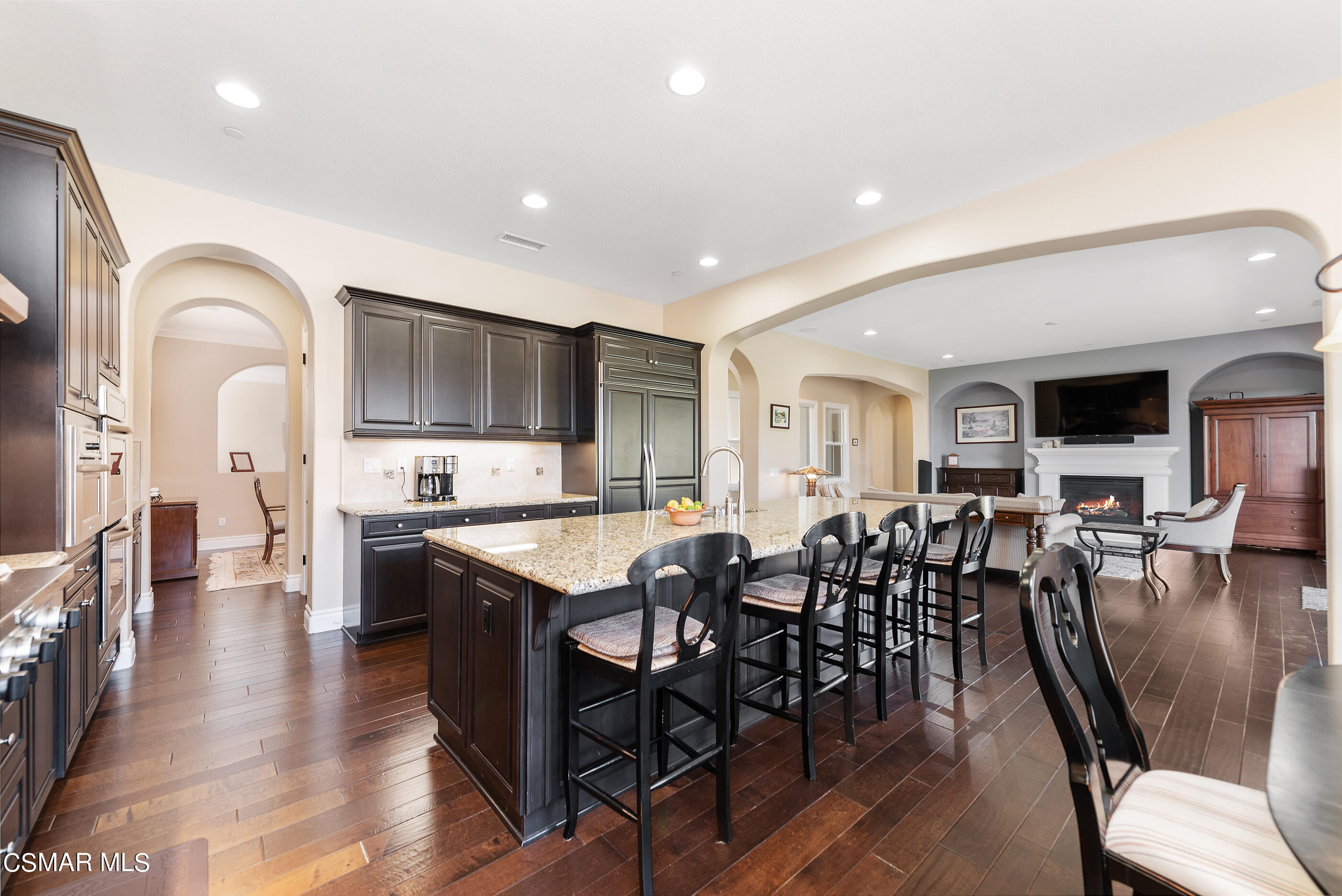 13740 Pinefield Court Moorpark, CA 93021 - Photo 18 of 62 a large kitchen with lots of furniture a sink appliances and dining table