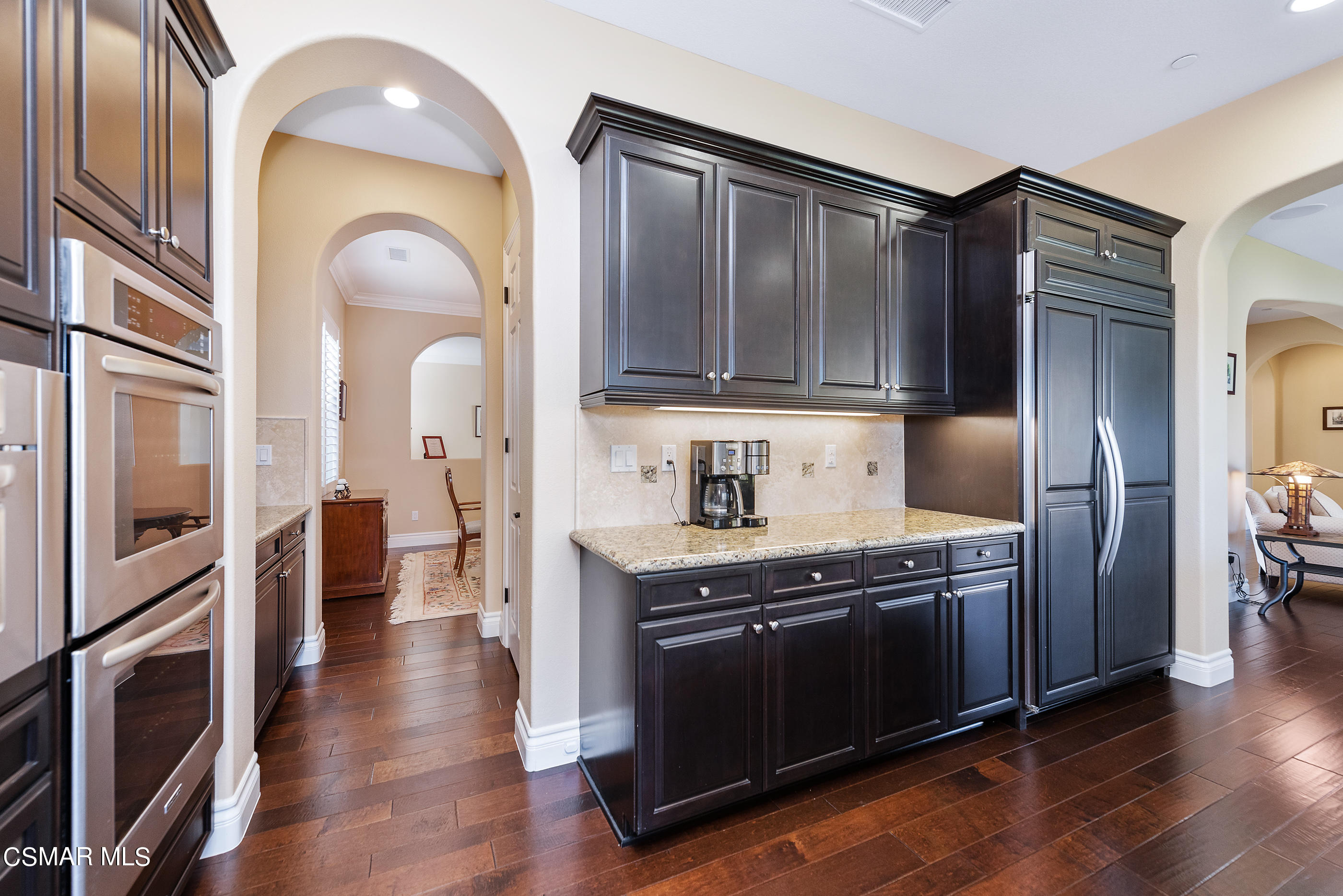 13740 Pinefield Court Moorpark, CA 93021 - Photo 19 of 62 a kitchen with stainless steel appliances granite countertop a stove a refrigerator and a microwave