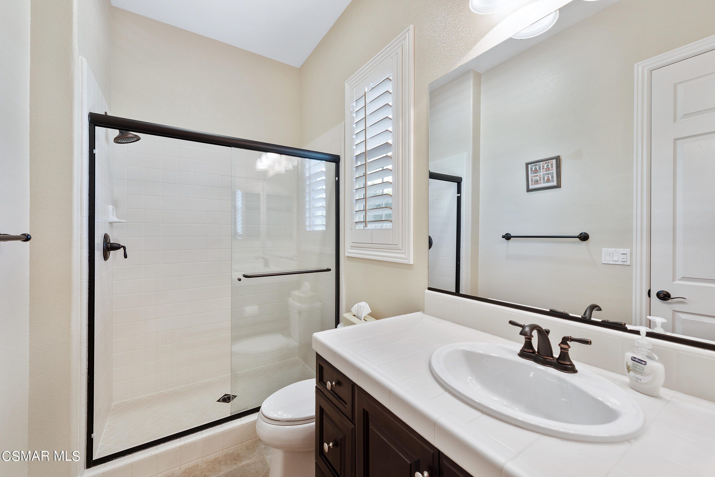 13740 Pinefield Court Moorpark, CA 93021 - Photo 30 of 62 a bathroom with a sink toilet and shower
