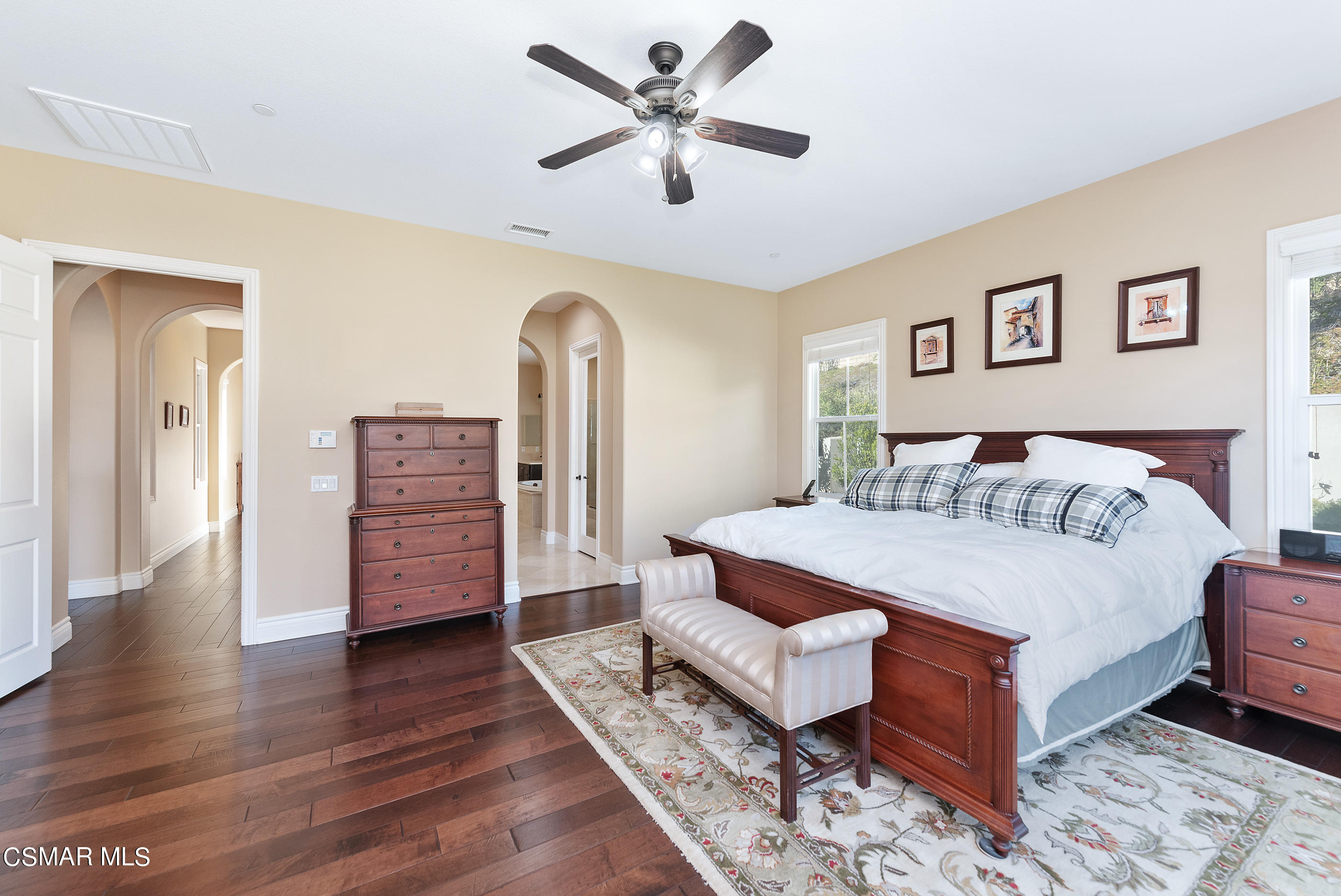 13740 Pinefield Court Moorpark, CA 93021 - Photo 32 of 62 a spacious bedroom with a bed and wooden floor