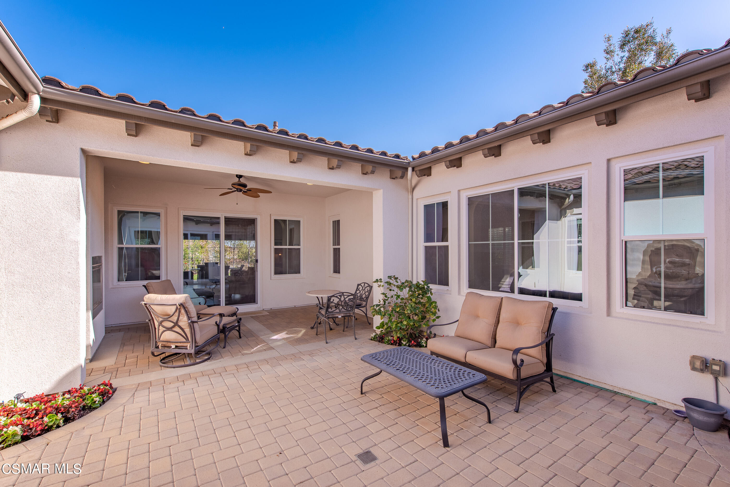 13740 Pinefield Court Moorpark, CA 93021 - Photo 40 of 62 a view of a patio with table and chairs and potted plants