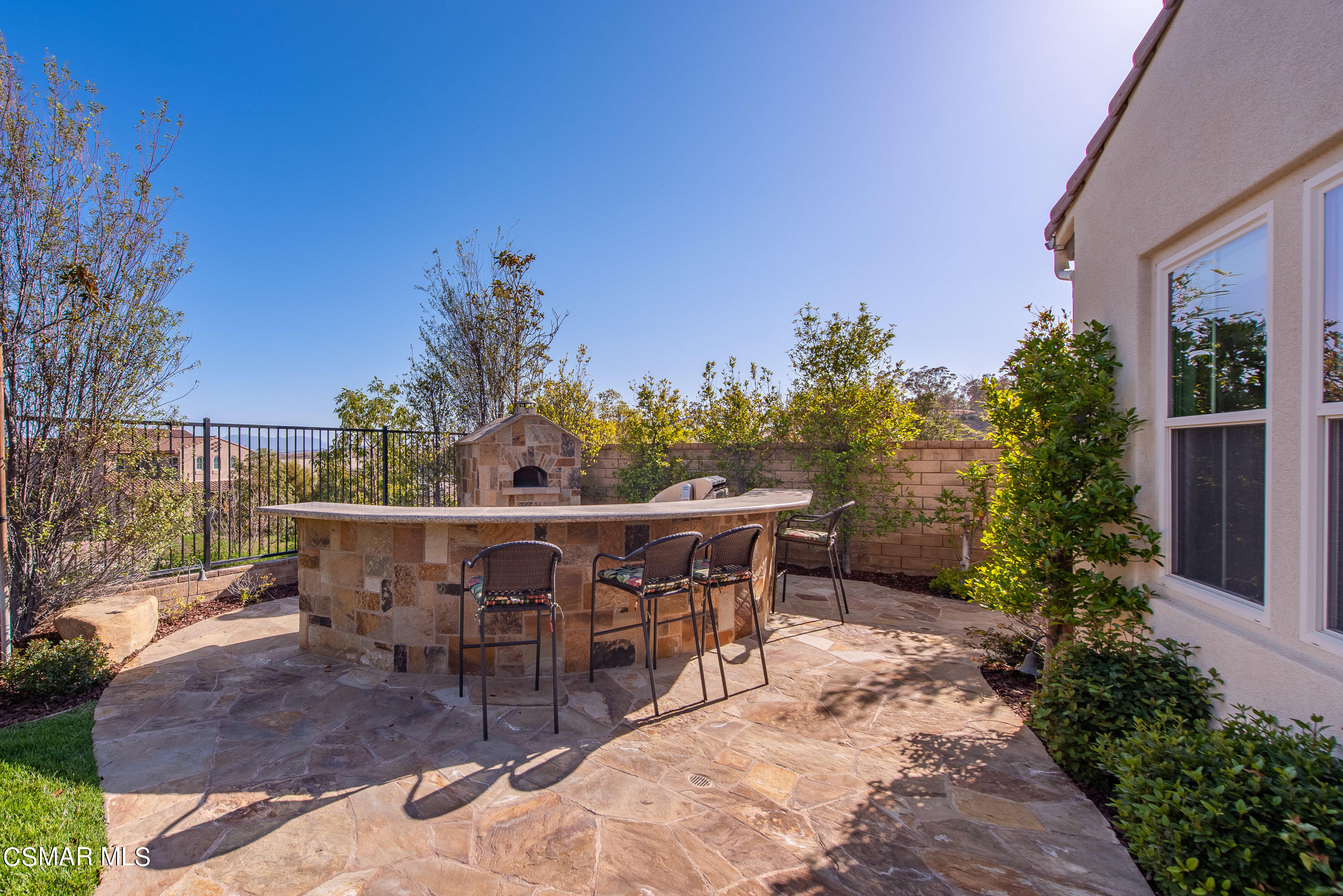 13740 Pinefield Court Moorpark, CA 93021 - Photo 51 of 62 a view of a patio with table and chairs with plants and trees