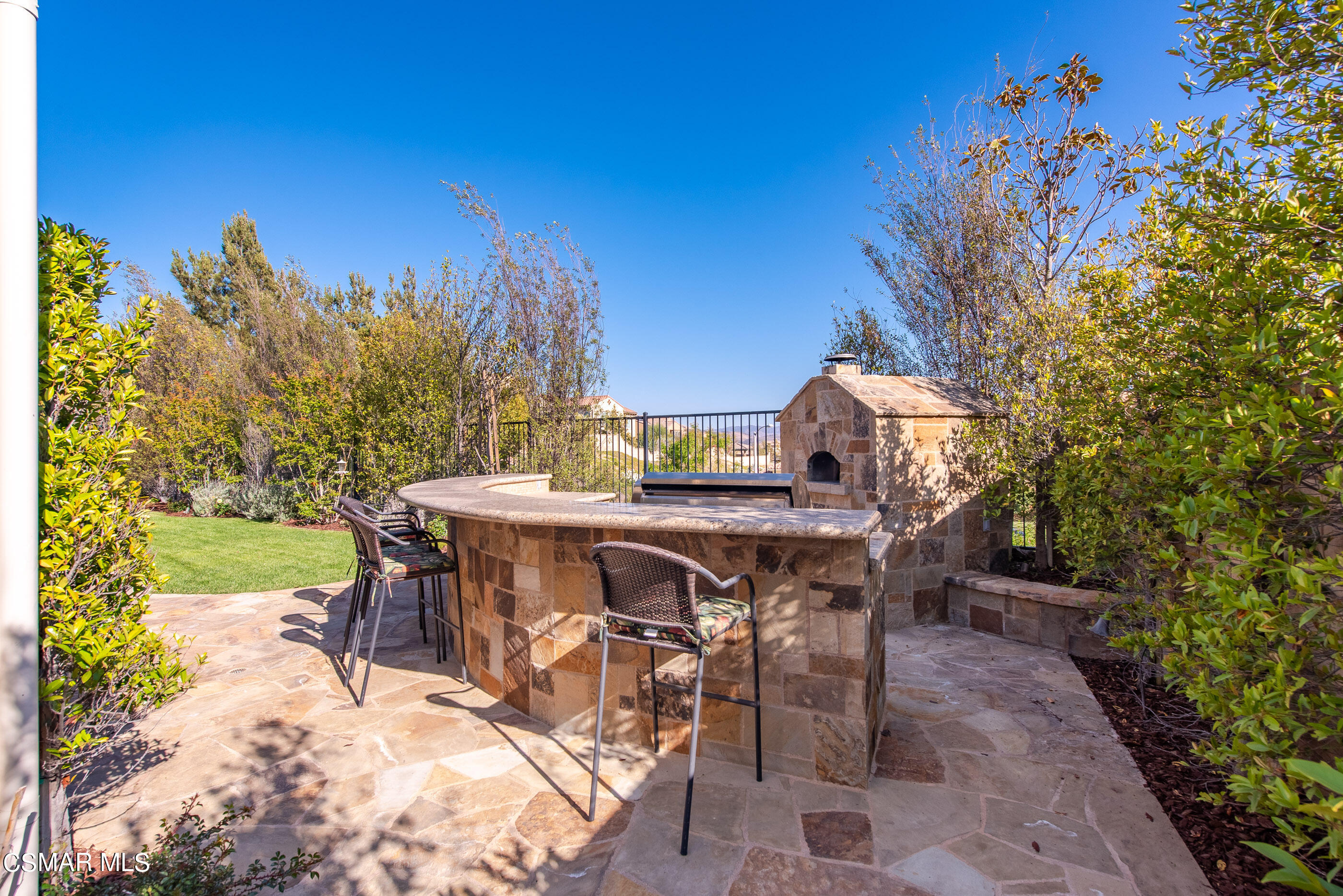 13740 Pinefield Court Moorpark, CA 93021 - Photo 54 of 62 a view of backyard with table and chairs and potted plants