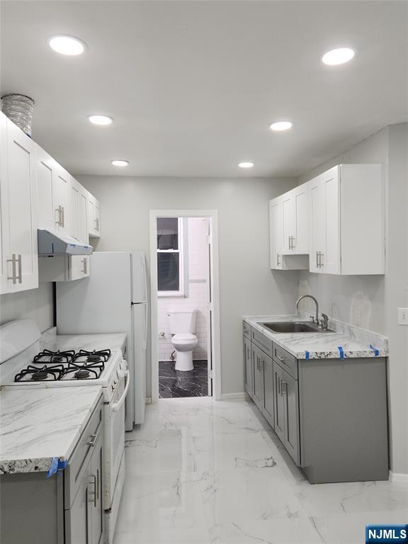 675 John F. Kennedy Boulevard Bayonne, NJ 07002 - Photo 1 of 4 a kitchen with a stove and a sink