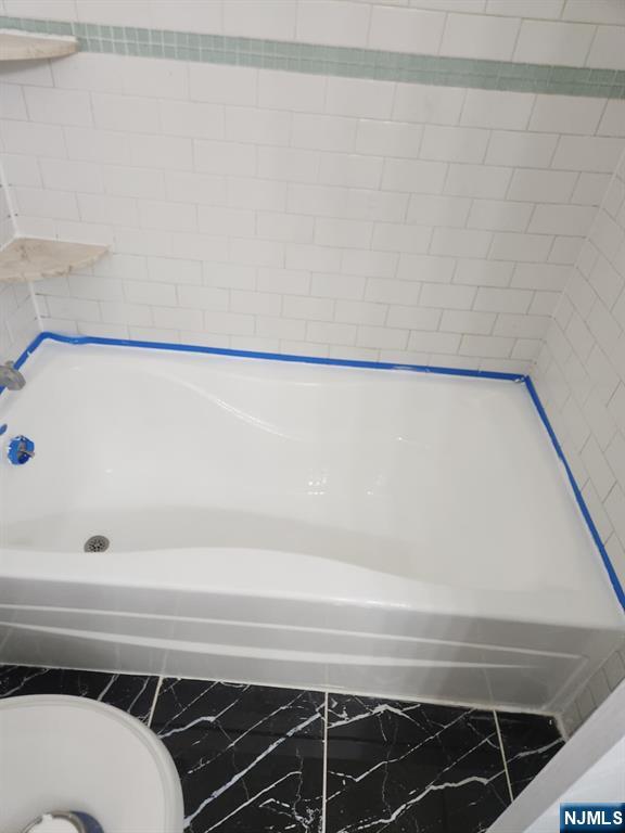 675 John F. Kennedy Boulevard Bayonne, NJ 07002 - Photo 4 of 4 a view of a bathtub in room