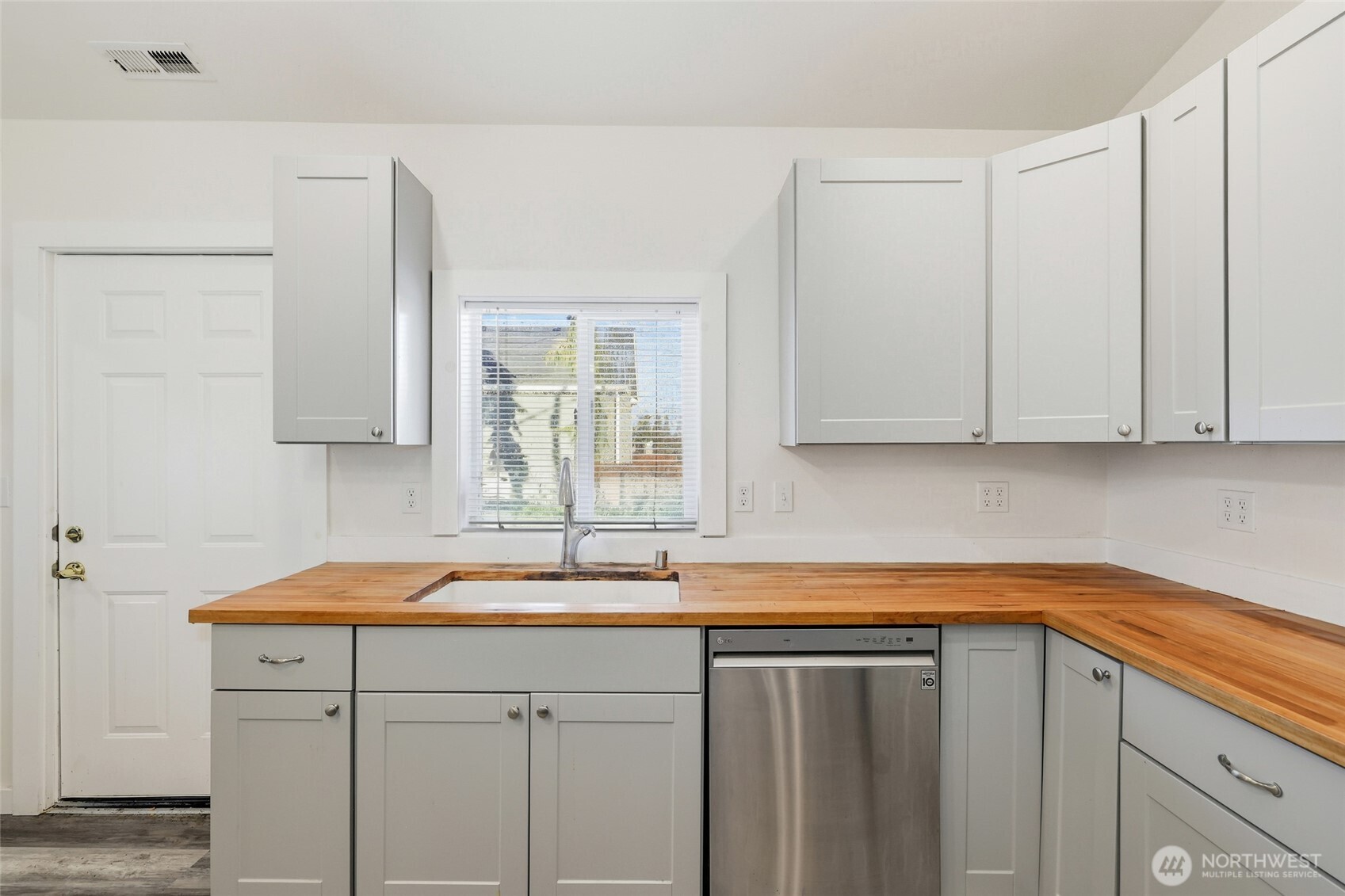 856 Northwest Folsom Street Chehalis, WA 98532 - Photo 11 of 38 a kitchen with a sink cabinets and a window