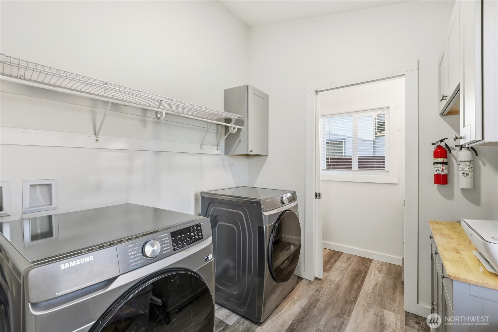 856 Northwest Folsom Street Chehalis, WA 98532 - Photo 13 of 38 a utility room with dryer washer and empty racks