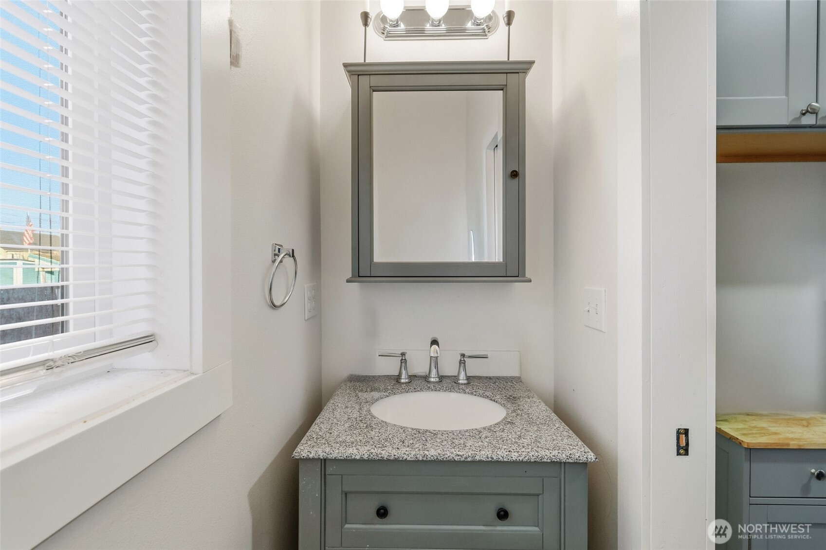856 Northwest Folsom Street Chehalis, WA 98532 - Photo 14 of 38 a bathroom with a granite countertop sink and a mirror