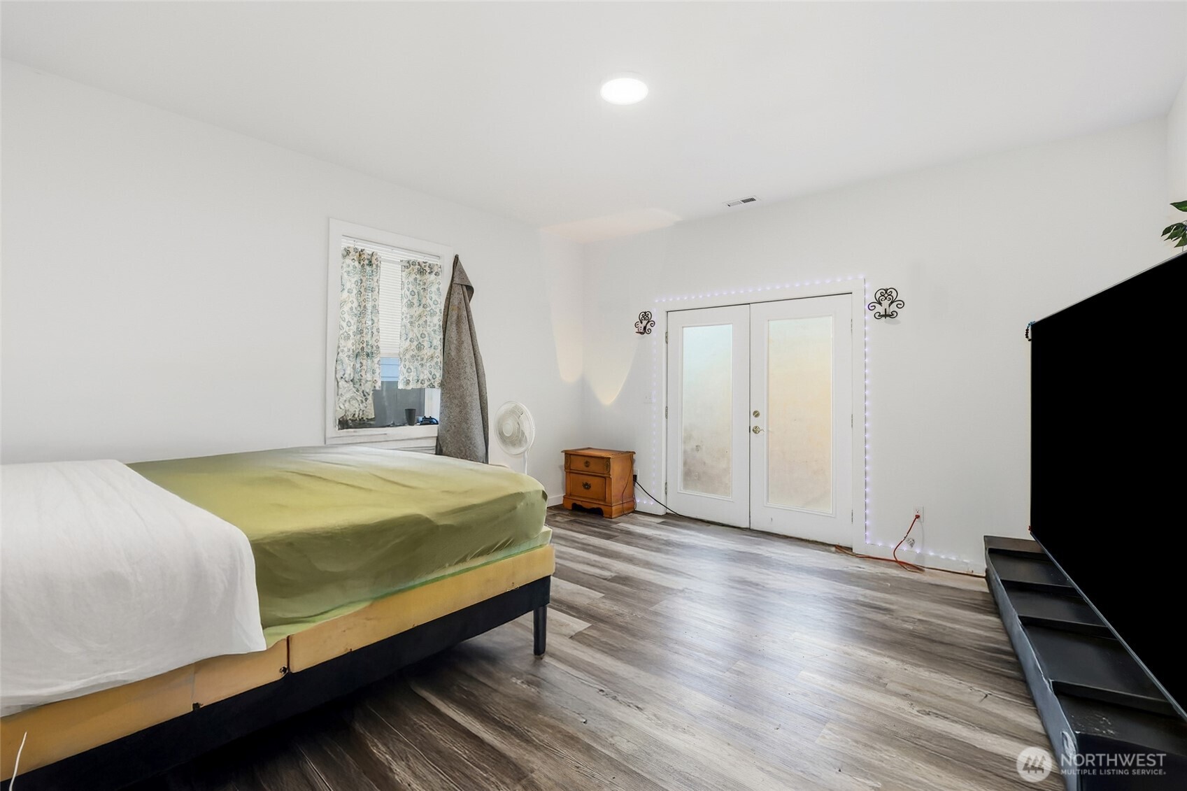 856 Northwest Folsom Street Chehalis, WA 98532 - Photo 15 of 38 a bedroom with a bed and a flat screen tv