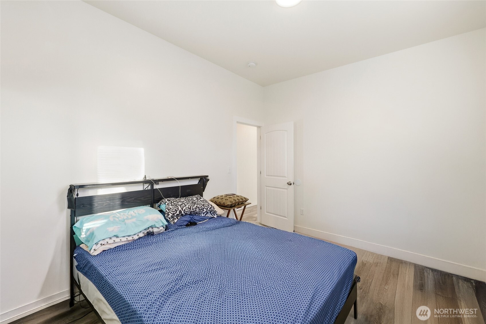 856 Northwest Folsom Street Chehalis, WA 98532 - Photo 20 of 38 a bedroom with a bed and wooden floor