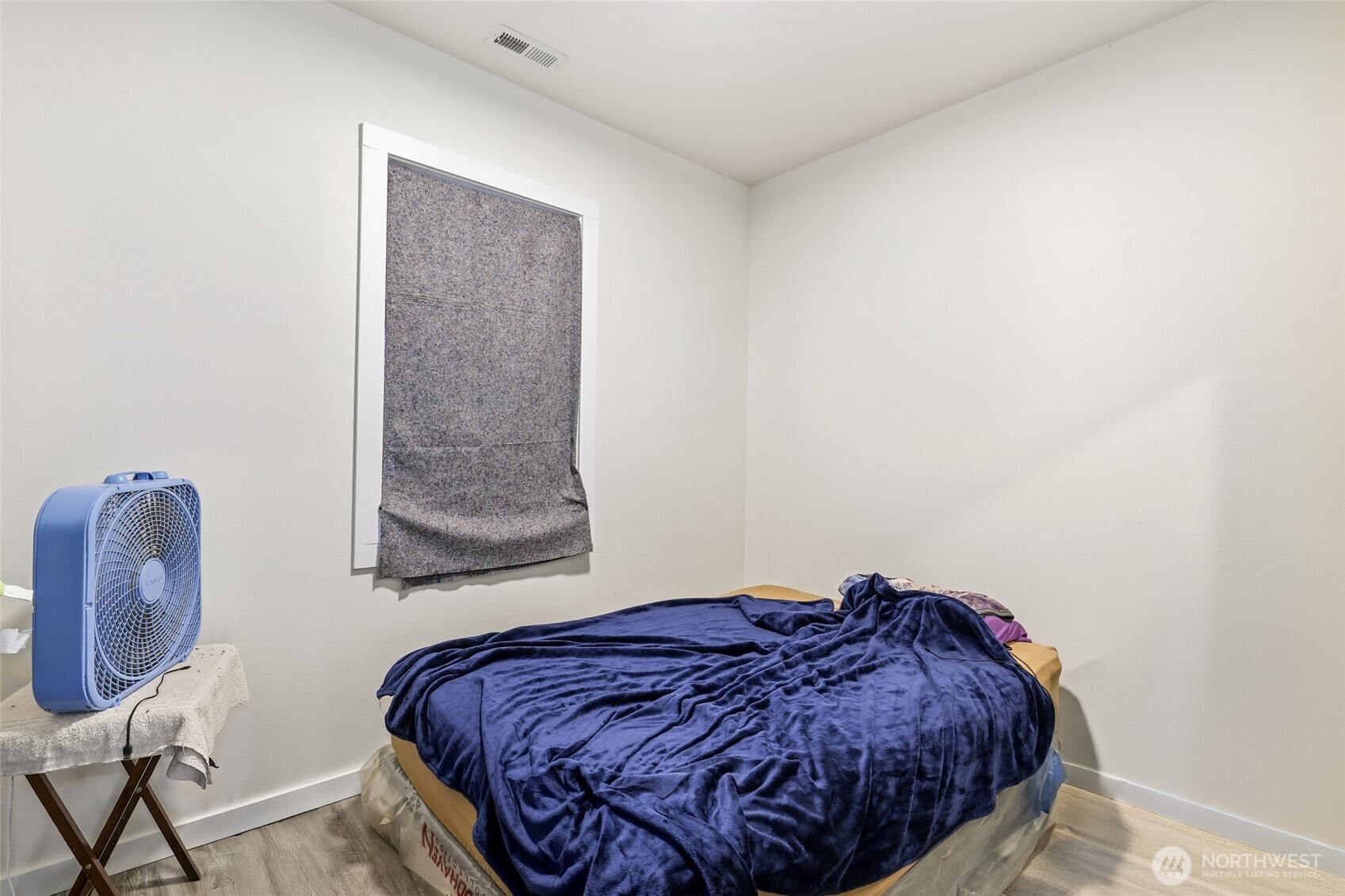 856 Northwest Folsom Street Chehalis, WA 98532 - Photo 23 of 38 a bedroom with a bed and a chair