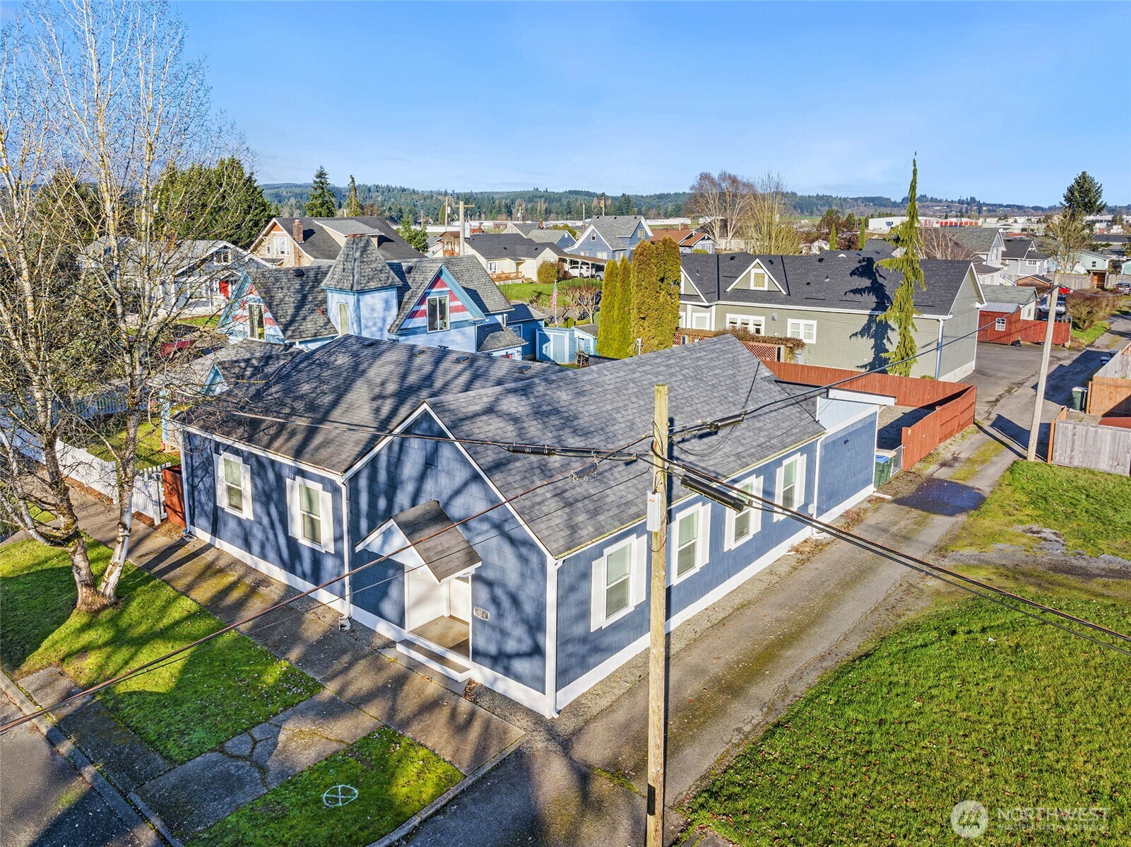 856 Northwest Folsom Street Chehalis, WA 98532 - Photo 31 of 38 an aerial view of a house with a garden and lake view