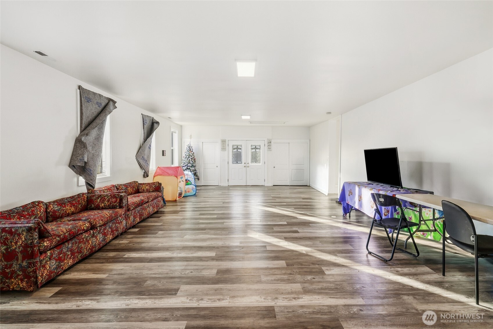 856 Northwest Folsom Street Chehalis, WA 98532 - Photo 4 of 38 a living room with furniture and a flat screen tv