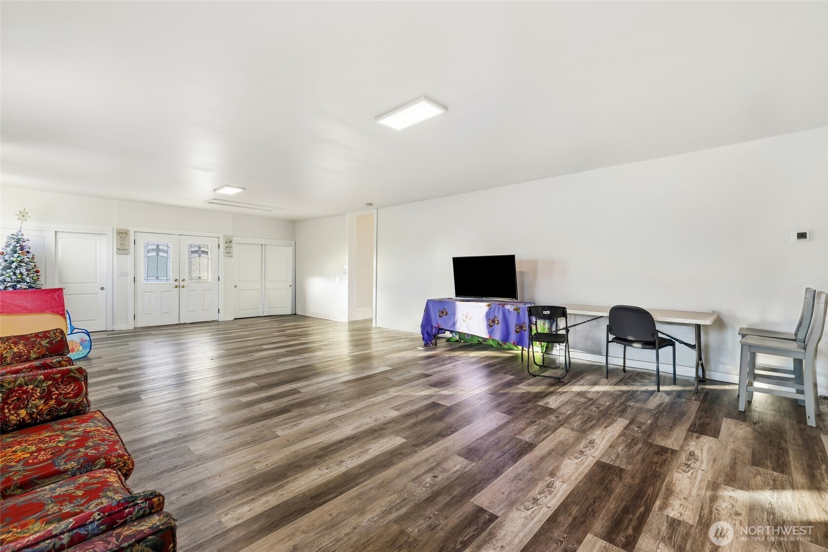 856 Northwest Folsom Street Chehalis, WA 98532 - Photo 5 of 38 a living room with furniture and a flat screen tv