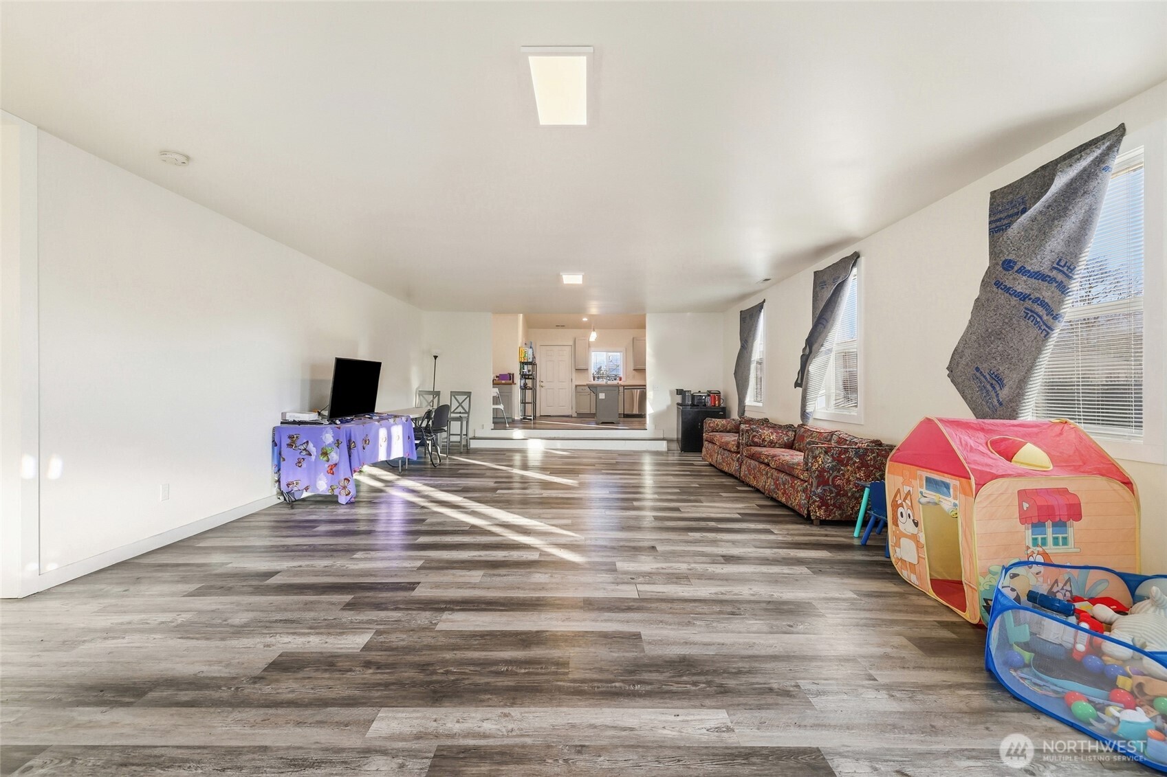 856 Northwest Folsom Street Chehalis, WA 98532 - Photo 6 of 38 a living room with furniture and a flat screen tv