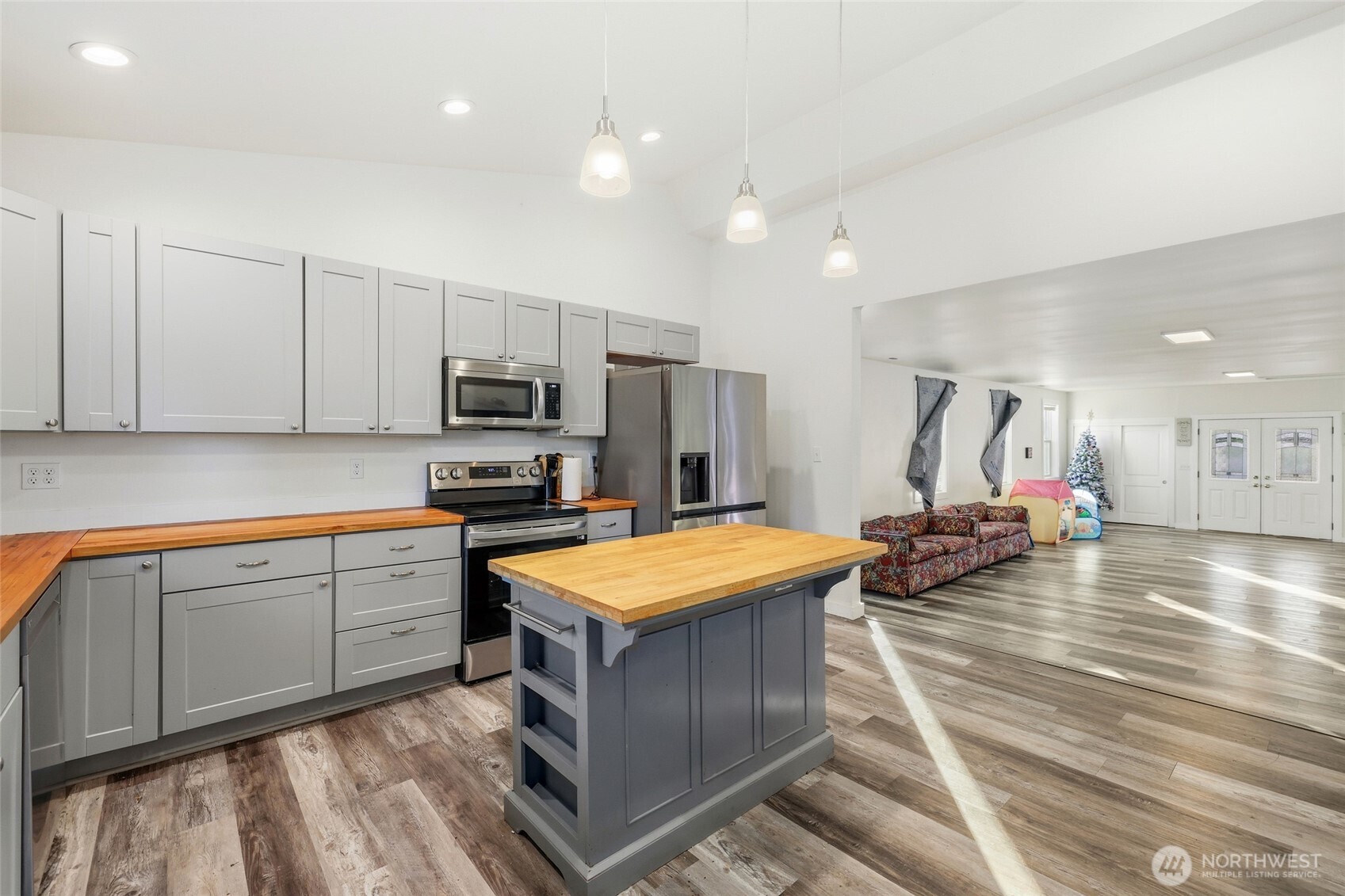 856 Northwest Folsom Street Chehalis, WA 98532 - Photo 8 of 38 a kitchen that has a lot of cabinets in it and wooden floors