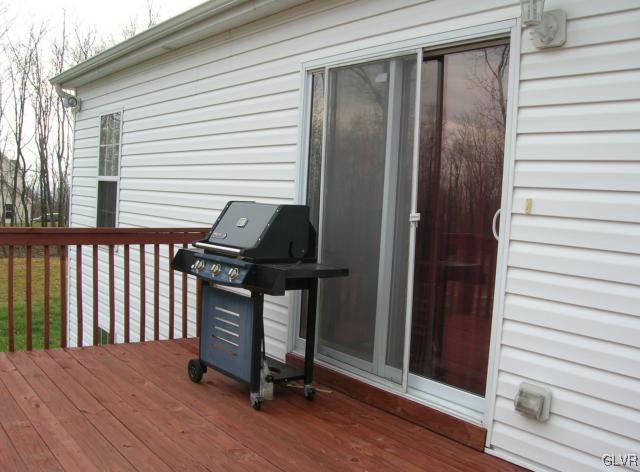24 Spokane Road Albrightsville, PA 18210 - Photo 35 of 38 View of the back deck featuring sliders leading to