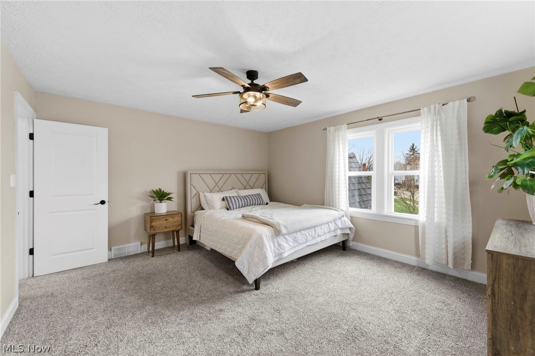 3525 Silsby Road Cleveland, OH 44118 - Photo 15 of 44 Bedroom with light colored carpet and a ceiling fan