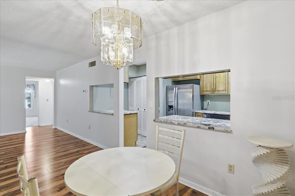 2666 Pine Ridge Way North, Unit C2 Palm Harbor, FL 34684 - Photo 16 of 74 a spacious bathroom with a sink a toilet and a mirror