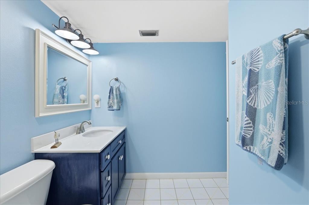 2666 Pine Ridge Way North, Unit C2 Palm Harbor, FL 34684 - Photo 42 of 74 a bathroom with a sink and a mirror