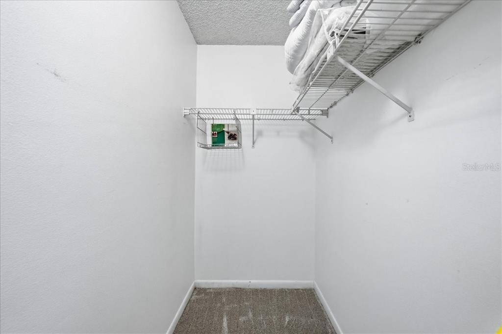 2666 Pine Ridge Way North, Unit C2 Palm Harbor, FL 34684 - Photo 47 of 74 a view of small space with racks on the wall