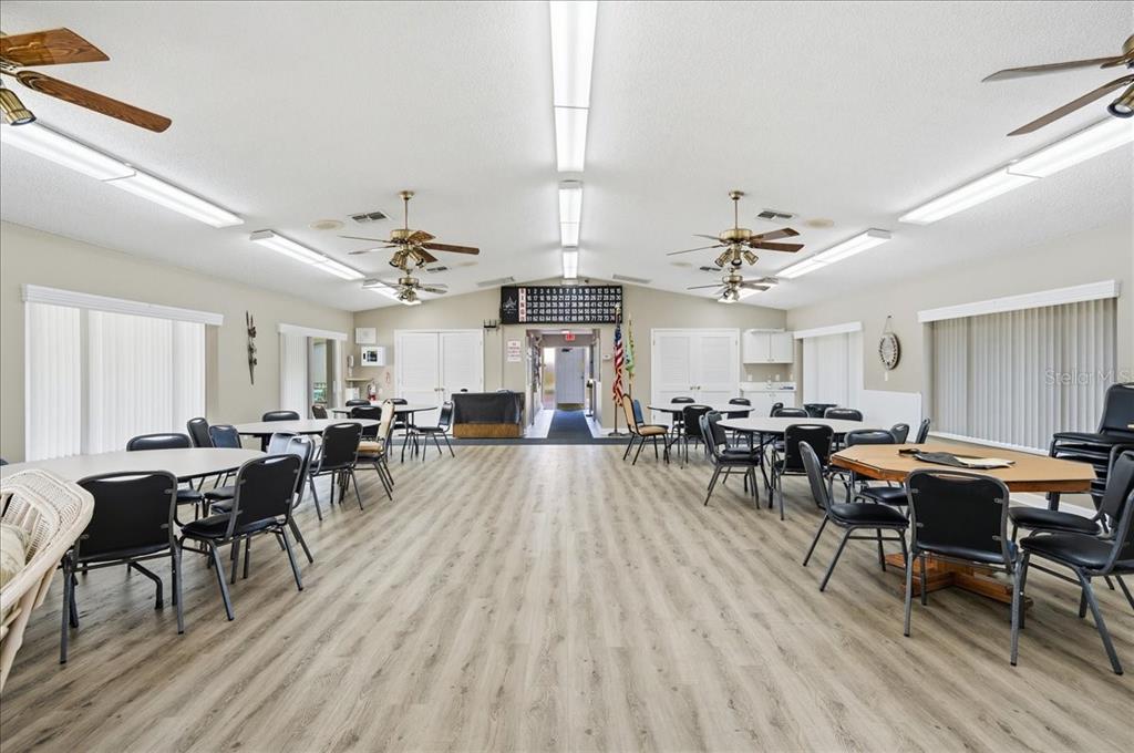 2666 Pine Ridge Way North, Unit C2 Palm Harbor, FL 34684 - Photo 65 of 74 a living room with lots of furniture and wooden floor
