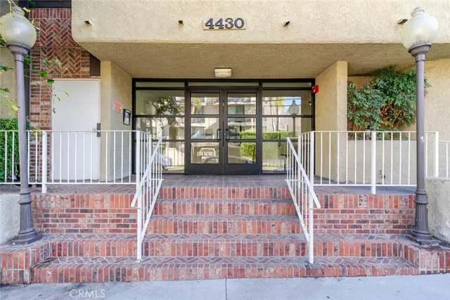 a view of a brick house with wooden floor