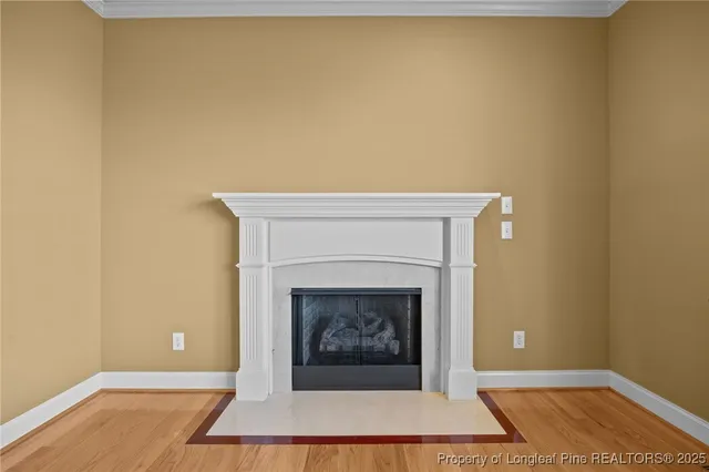 a living room with a fireplace and a rug
