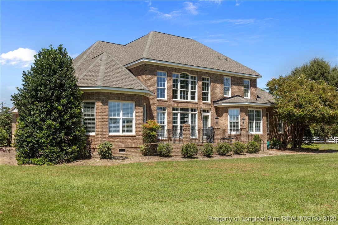 8224 Highway 210 Angier, NC 27501 - Photo 2 of 50 a front view of a house with garden