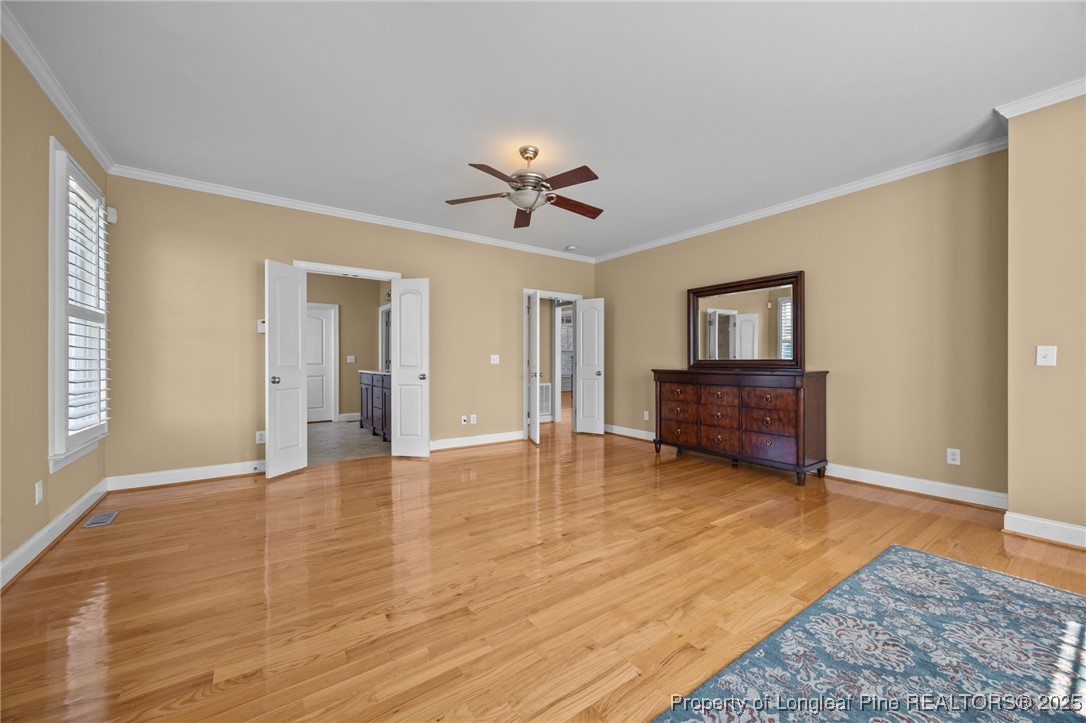 8224 Highway 210 Angier, NC 27501 - Photo 25 of 50 a view of an empty room with window and wooden floor