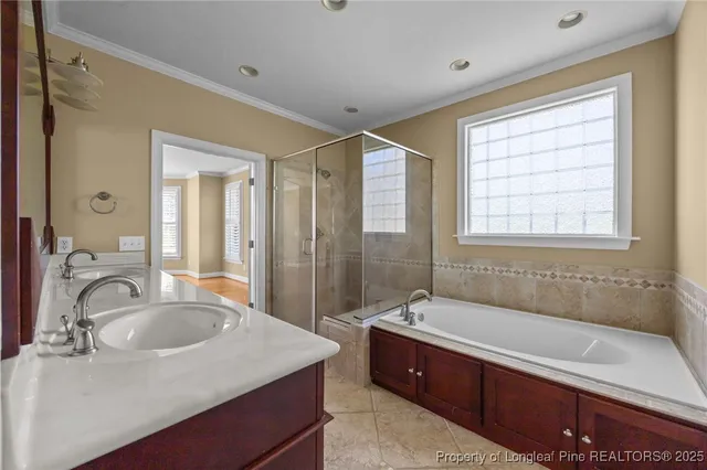 a bathroom with sink bathtub and shower