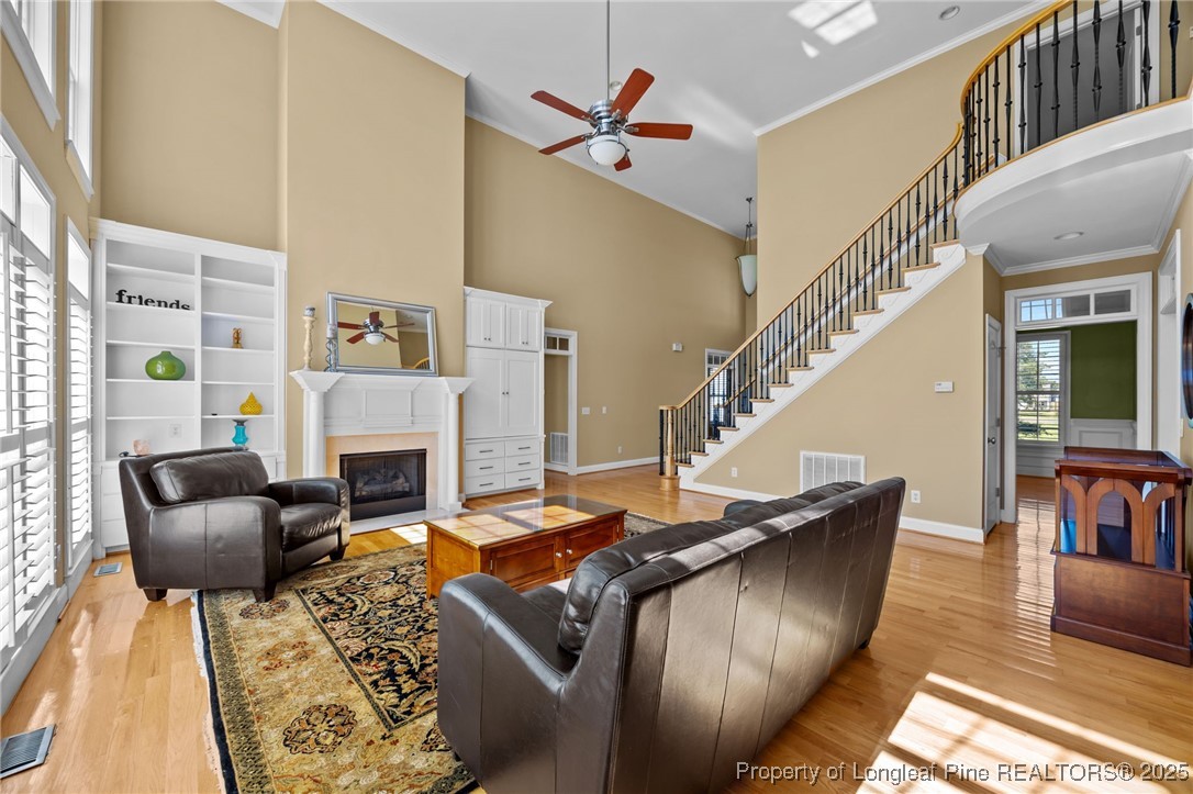 8224 Highway 210 Angier, NC 27501 - Photo 32 of 50 a living room with furniture fireplace and dining table
