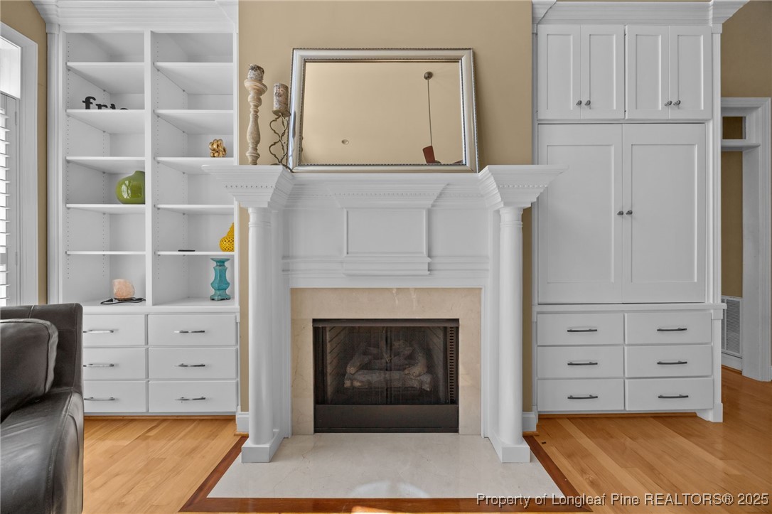 8224 Highway 210 Angier, NC 27501 - Photo 33 of 50 a view of an empty room with cabinet cabinet and a fireplace