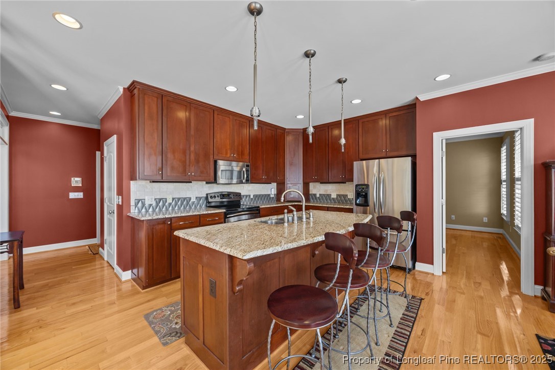 8224 Highway 210 Angier, NC 27501 - Photo 37 of 50 a large kitchen with kitchen island a large island in the center