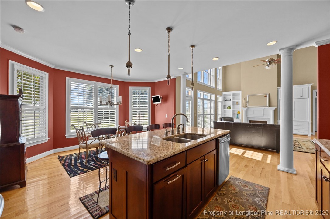 8224 Highway 210 Angier, NC 27501 - Photo 39 of 50 a kitchen with kitchen island granite countertop a sink and a stove