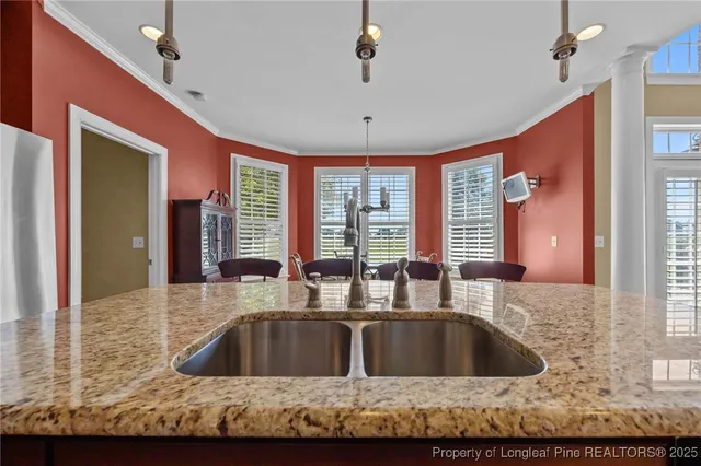 a view of kitchen sink and cabinet
