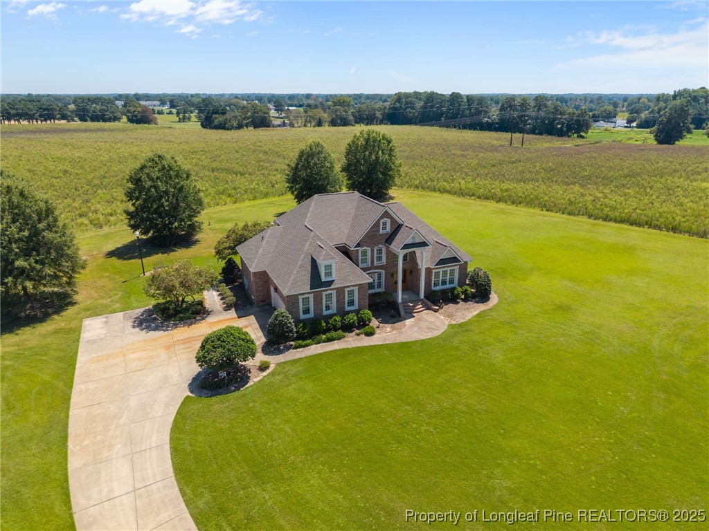 8224 Highway 210 Angier, NC 27501 - Photo 4 of 50 an aerial view of a house with outdoor space and a lake view