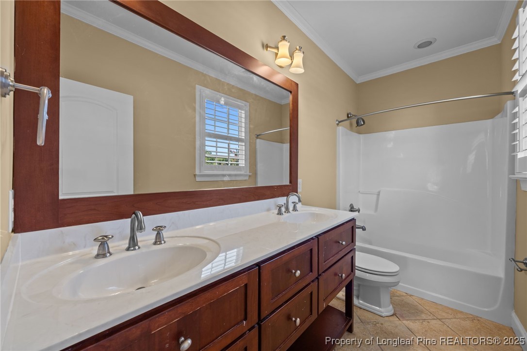 8224 Highway 210 Angier, NC 27501 - Photo 44 of 50 a bathroom with a sink a toilet and shower